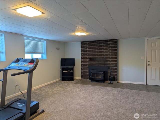 22894 Carmella Rd NW, Poulsbo, WA 98370 - workout room featuring carpet floors and a wood stove