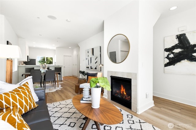 6816 NE 153rd Pl Unit D, Kenmore, WA 98028 - living area featuring wood finished floors, a tile fireplace, baseboards, and recessed lighting