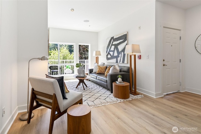 6816 NE 153rd Pl Unit D, Kenmore, WA 98028 - living room featuring light wood-type flooring and baseboards