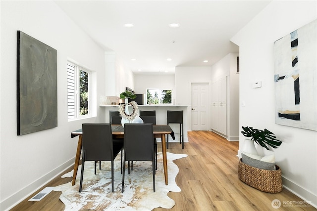 6816 NE 153rd Pl Unit D, Kenmore, WA 98028 - dining area featuring light wood-style floors, baseboards, and recessed lighting