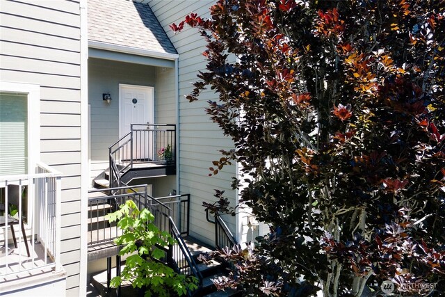 6816 NE 153rd Pl Unit D, Kenmore, WA 98028 - doorway to property featuring roof with shingles