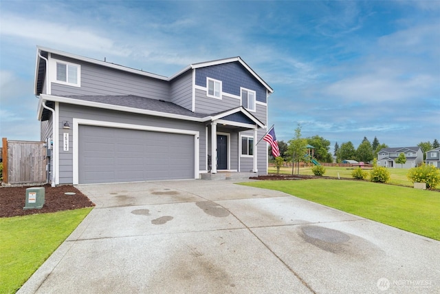 15177 Prescott Loop SE, Yelm, WA 98597 - traditional home featuring concrete driveway, a playground, and a garage