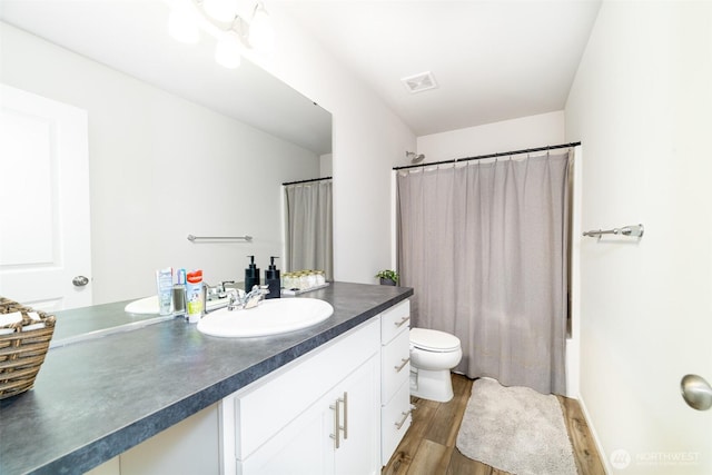 15177 Prescott Loop SE, Yelm, WA 98597 - full bath with vanity, wood finished floors, and shower / bath combination with curtain