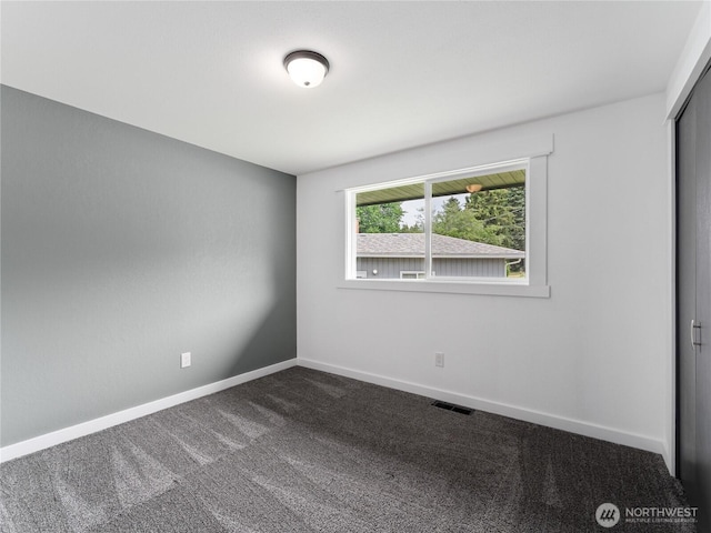 2540 N Astor Ave, East Wenatchee, WA 98801 - unfurnished room featuring dark colored carpet and baseboards