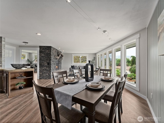 2540 N Astor Ave, East Wenatchee, WA 98801 - dining space with wood finished floors and a stone fireplace