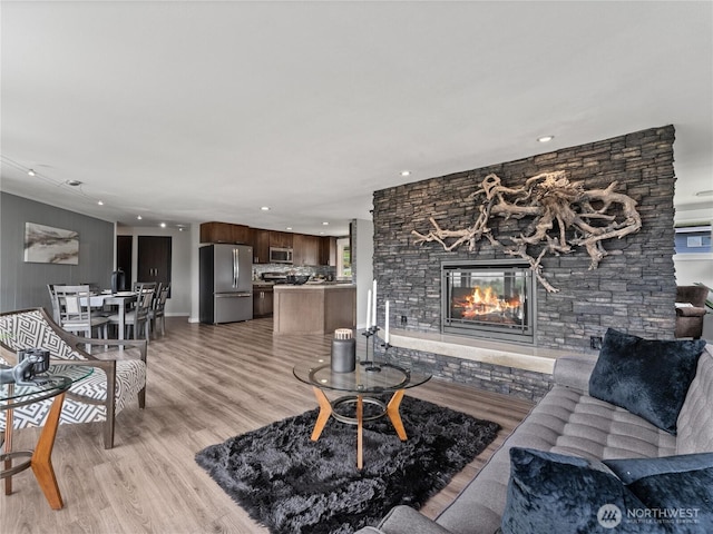 2540 N Astor Ave, East Wenatchee, WA 98801 - living room featuring recessed lighting, a fireplace, and light wood-style flooring
