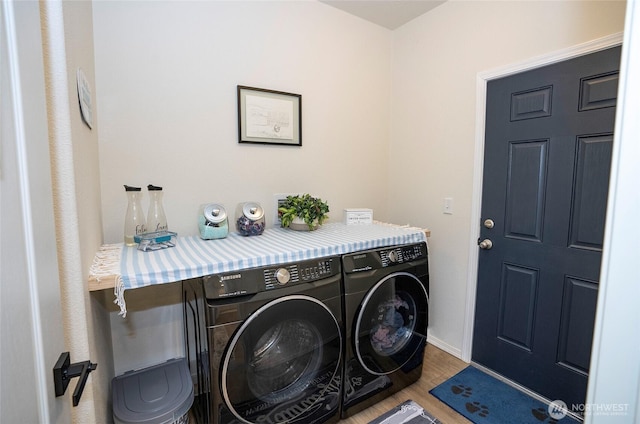 170 E Soundview Dr E, Shelton, WA 98584 - laundry area with washing machine and dryer and wood finished floors