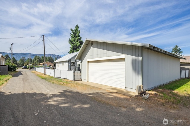 819 1st St, Cle Elum, WA 98922 - garage with dirt driveway and a mountain view