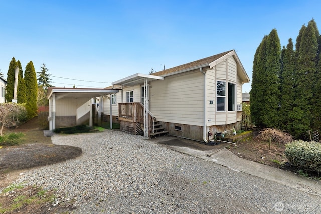 7311 Chambers Creek Rd W Unit 28, University Place, WA 98467 - back of property with gravel driveway and crawl space