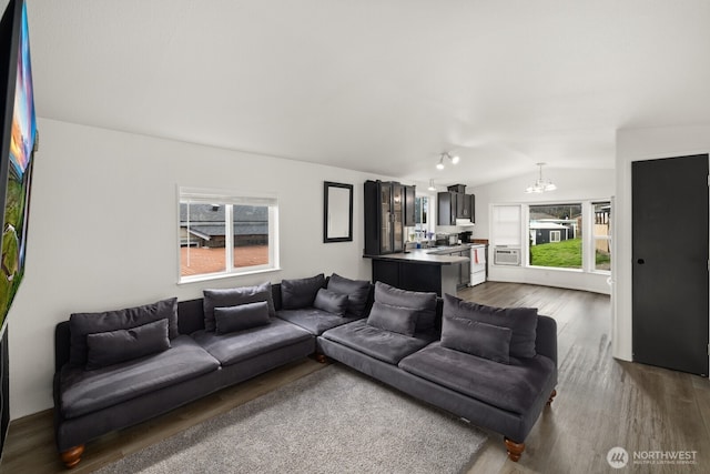 7311 Chambers Creek Rd W Unit 28, University Place, WA 98467 - living area with dark wood-style floors, a chandelier, and lofted ceiling