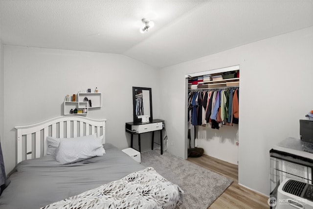 7311 Chambers Creek Rd W Unit 28, University Place, WA 98467 - bedroom with wood finished floors, lofted ceiling, and a closet