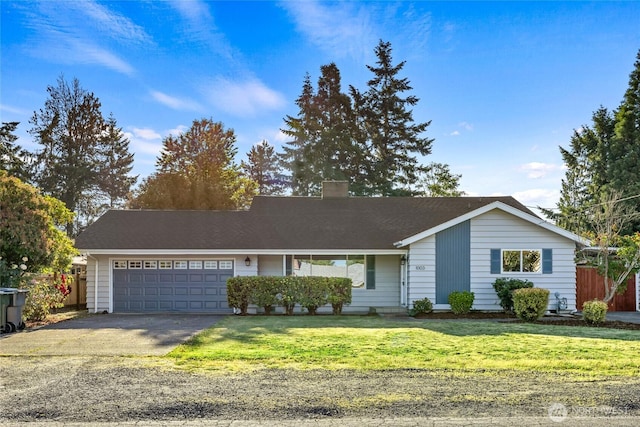 1003 9th St NW, Puyallup, WA 98371 - ranch-style home featuring an attached garage, a chimney, and asphalt driveway