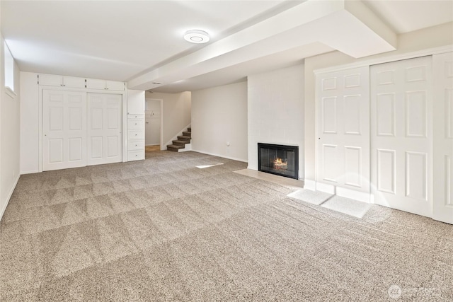 1003 9th St NW, Puyallup, WA 98371 - finished below grade area featuring carpet floors, stairway, and a fireplace