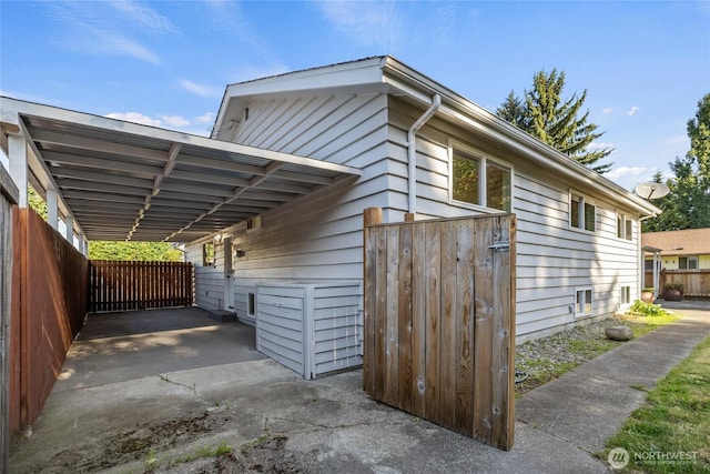 1003 9th St NW, Puyallup, WA 98371 - view of property exterior featuring a carport