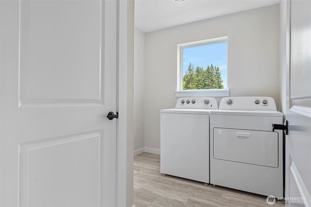 7150 90th Street Ct E, Puyallup, WA 98371 - laundry area with independent washer and dryer, light wood-type flooring, and baseboards