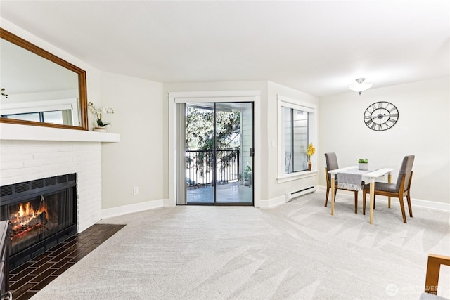 12505 NE 116th St Unit A26, Kirkland, WA 98034 - living room with baseboard heating, carpet, and a brick fireplace