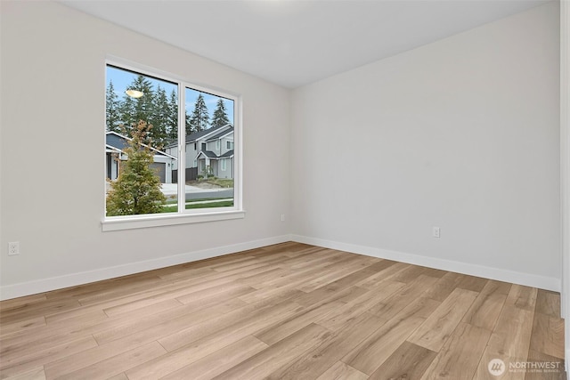 9036 71st Avenue Ct E, Puyallup, WA 98371 - unfurnished room featuring light wood finished floors and baseboards