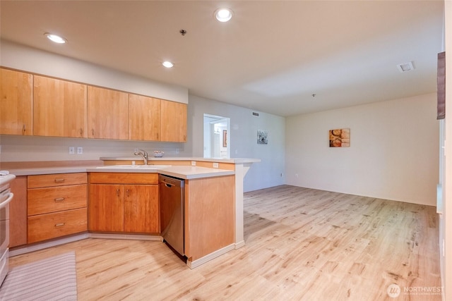 16219 Northup Way Unit C-202, Bellevue, WA 98008 - kitchen with stainless steel dishwasher, a peninsula, light wood-type flooring, light countertops, and recessed lighting