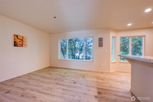 16219 Northup Way Unit C-202, Bellevue, WA 98008 - unfurnished room featuring light wood-style flooring and recessed lighting