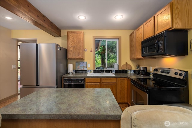 1026 Chinook Way, Center Island, WA 98221 - kitchen with black appliances, beamed ceiling, recessed lighting, wood finished floors, and dark countertops