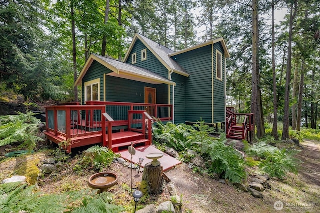 1026 Chinook Way, Center Island, WA 98221 - rear view of house with a deck and a shingled roof