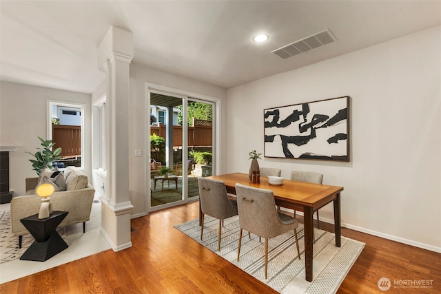 11734 167th Ct NE, Redmond, WA 98052 - dining space featuring ornate columns, wood finished floors, and recessed lighting