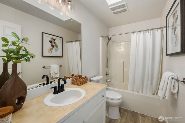 11734 167th Ct NE, Redmond, WA 98052 - bathroom featuring vanity, wood finished floors, and shower / tub combo