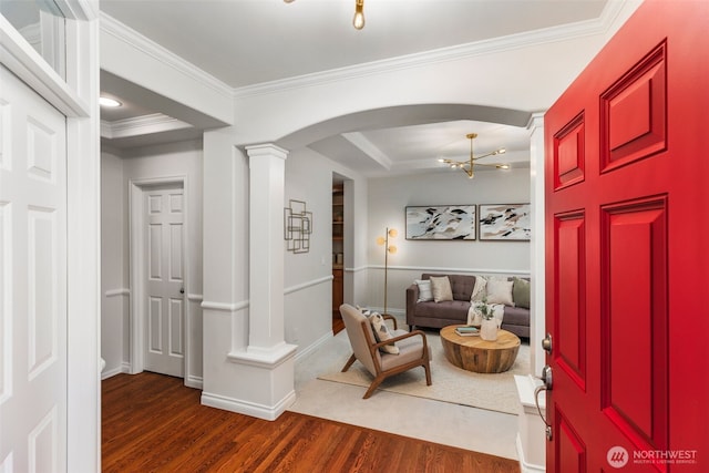 11734 167th Ct NE, Redmond, WA 98052 - foyer entrance with wood finished floors, arched walkways, crown molding, a chandelier, and ornate columns