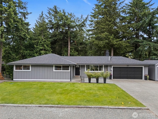2422 179th Ave E, Lake Tapps, WA 98391 - view of front facade featuring a front lawn, an attached garage, concrete driveway, and roof with shingles