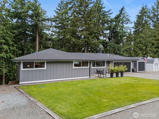 2422 179th Ave E, Lake Tapps, WA 98391 - view of front facade with a garage, a front yard, driveway, a chimney, and roof with shingles