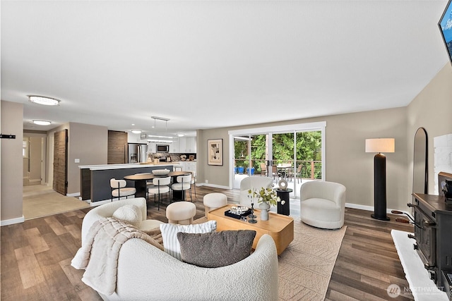 2422 179th Ave E, Lake Tapps, WA 98391 - living room featuring baseboards and dark wood-style flooring
