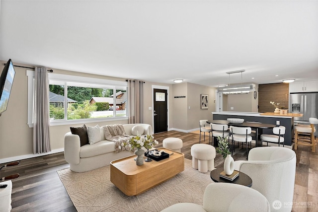 2422 179th Ave E, Lake Tapps, WA 98391 - living room featuring baseboards and wood finished floors