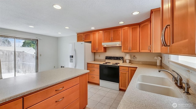 22230 100th Ave SE, Kent, WA 98031 - kitchen with electric range oven, under cabinet range hood, white fridge with ice dispenser, recessed lighting, and light countertops
