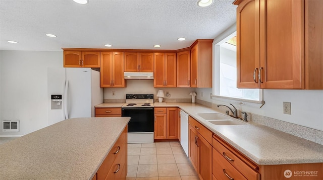 22230 100th Ave SE, Kent, WA 98031 - kitchen featuring white appliances, under cabinet range hood, light countertops, recessed lighting, and brown cabinets