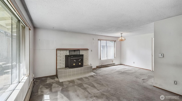 22230 100th Ave SE, Kent, WA 98031 - unfurnished living room featuring baseboard heating, a textured ceiling, carpet, and a chandelier