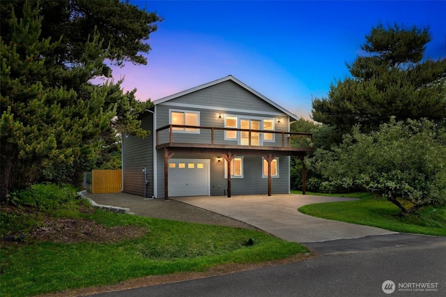 356 N Wynoochee Dr SW, Ocean Shores, WA 98569 - view of front of home with driveway, an attached garage, a front yard, and a balcony