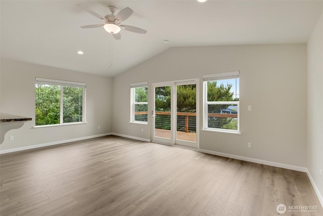 356 N Wynoochee Dr SW, Ocean Shores, WA 98569 - unfurnished living room with ceiling fan, wood finished floors, vaulted ceiling, and recessed lighting