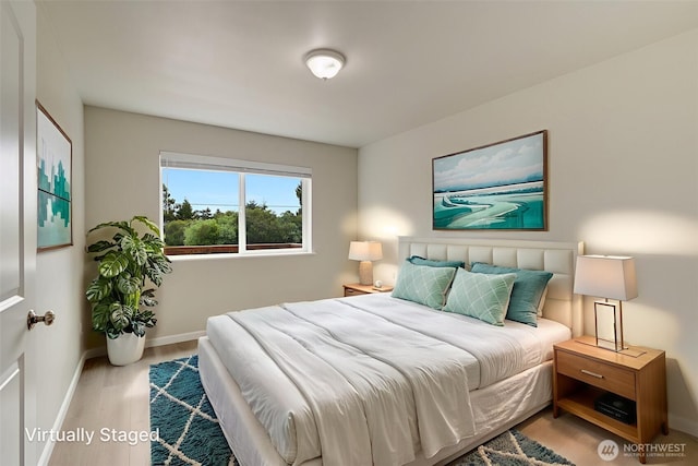 356 N Wynoochee Dr SW, Ocean Shores, WA 98569 - bedroom featuring baseboards and wood finished floors