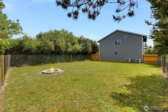 356 N Wynoochee Dr SW, Ocean Shores, WA 98569 - fenced backyard featuring a fire pit