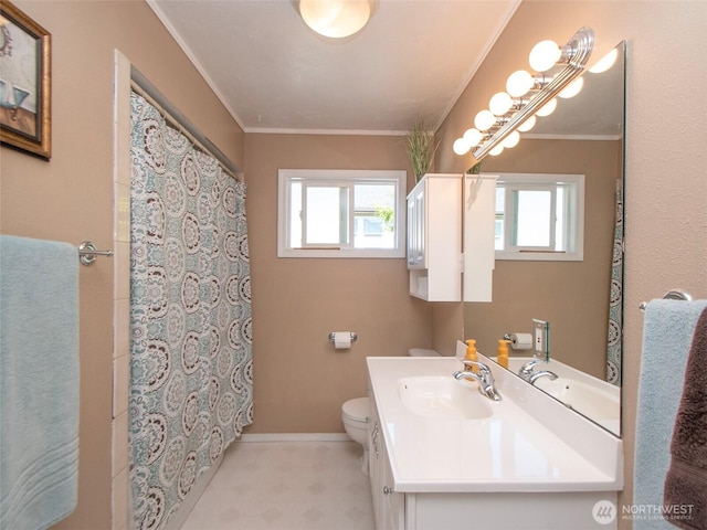 1011 E 5th St, Port Angeles, WA 98362 - full bathroom featuring healthy amount of natural light, vanity, toilet, baseboards, and crown molding