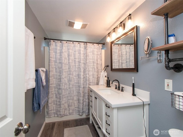 1011 E 5th St, Port Angeles, WA 98362 - full bath featuring wood finished floors and vanity