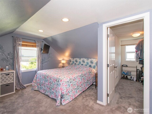 1011 E 5th St, Port Angeles, WA 98362 - carpeted bedroom featuring vaulted ceiling, multiple windows, baseboards, and recessed lighting