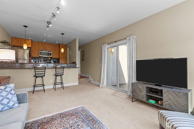 8503 Bowdoin Way Unit 203, Edmonds, WA 98026 - living room featuring light carpet and baseboards