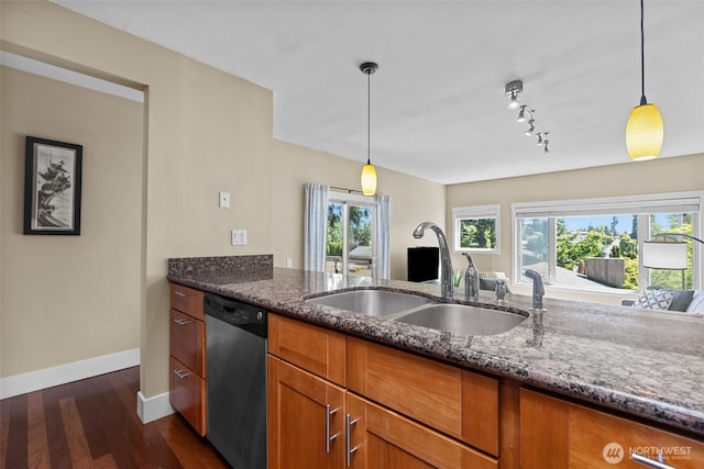 8503 Bowdoin Way Unit 203, Edmonds, WA 98026 - kitchen featuring dishwasher, a sink, brown cabinetry, and dark stone counters