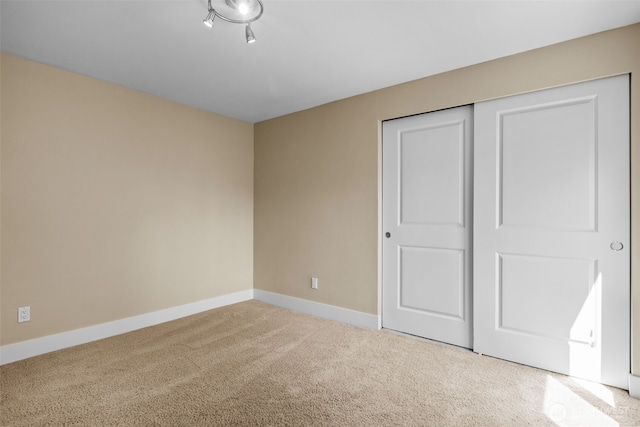 8503 Bowdoin Way Unit 203, Edmonds, WA 98026 - unfurnished bedroom with carpet floors, baseboards, and a closet