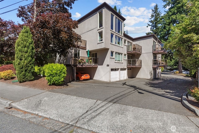 8503 Bowdoin Way Unit 203, Edmonds, WA 98026 - view of property featuring a garage and driveway