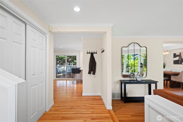 5610 S 296th Ct, Auburn, WA 98001 - hallway with light wood-style flooring, a chandelier, ornamental molding, and recessed lighting