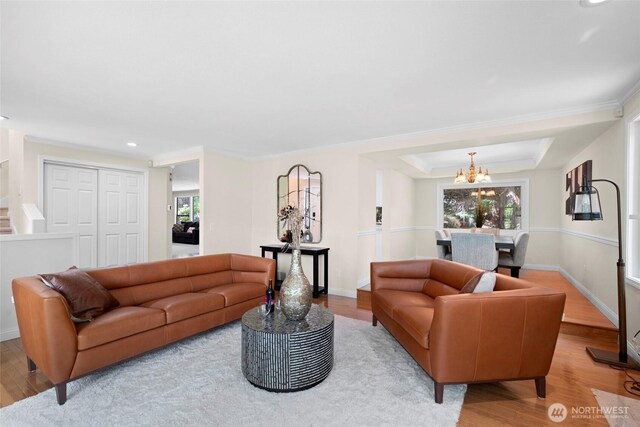 5610 S 296th Ct, Auburn, WA 98001 - living room featuring healthy amount of natural light, wood finished floors, a chandelier, recessed lighting, and ornamental molding