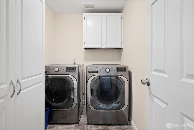 5610 S 296th Ct, Auburn, WA 98001 - laundry area featuring washer and dryer and cabinet space
