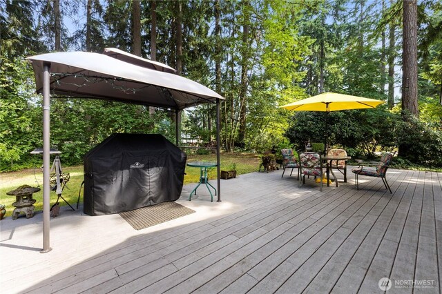 8415 57th Ave E, Puyallup, WA 98371 - wooden deck with a gazebo, a grill, and view of scattered trees